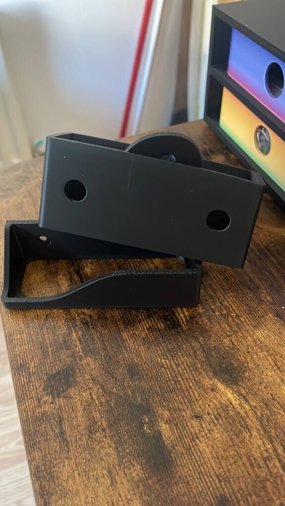 Black functional stand, bracket, or cradle